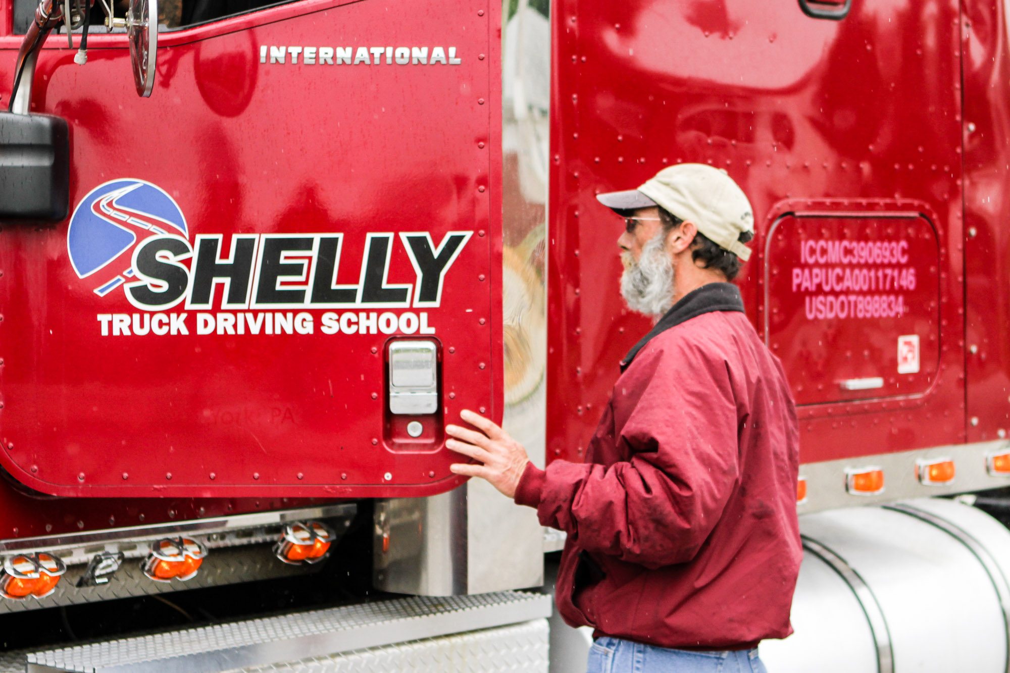 Truck driving instructor training with a student.
