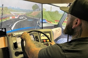 Student practicing on the truck driving simulator.